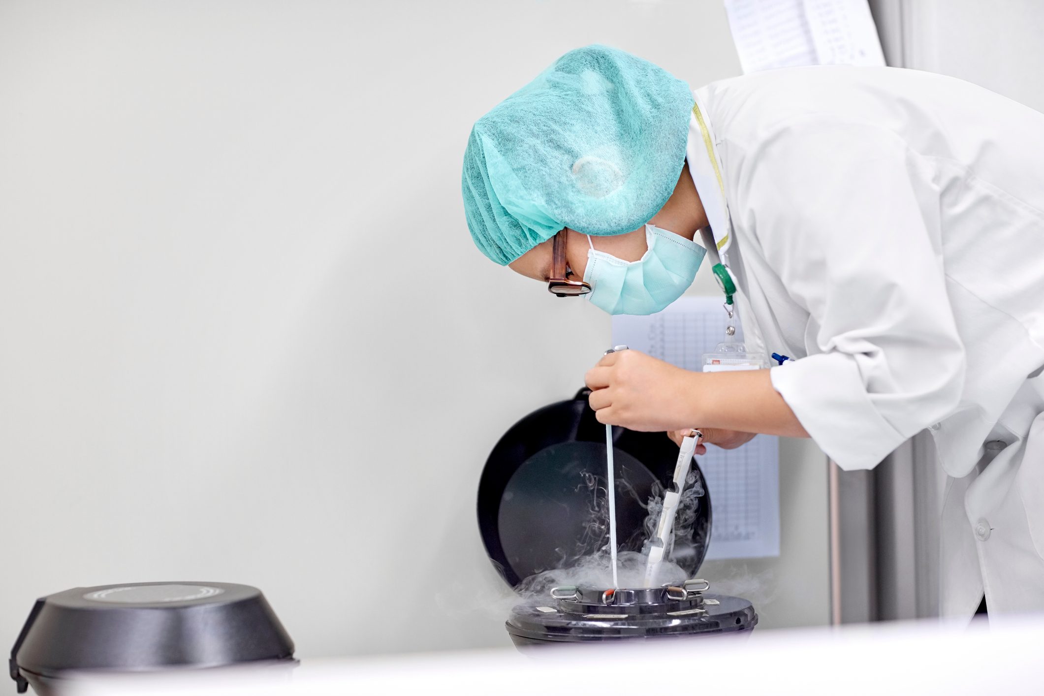 scientist handling oocytes and sperm for cryopreservation to be stored in liquid nitrogen.